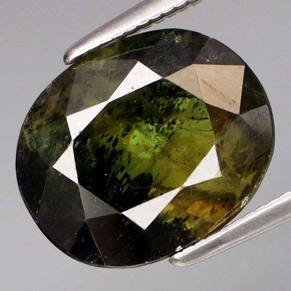 Huge 6.04ct deep swirling green high luster Sapphire!