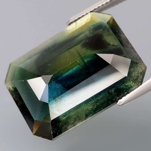 Massive! 13.02ct emerald cut Sapphire with swirling saturation!