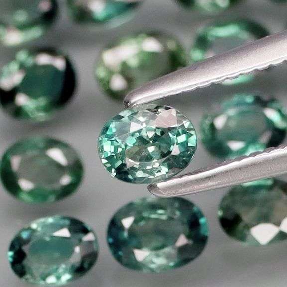 Heated only! 3.19ct blue green Sapphire set