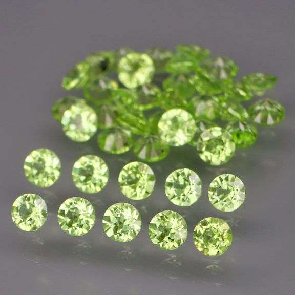High grade 7.43ct untreated apple green Peridot set