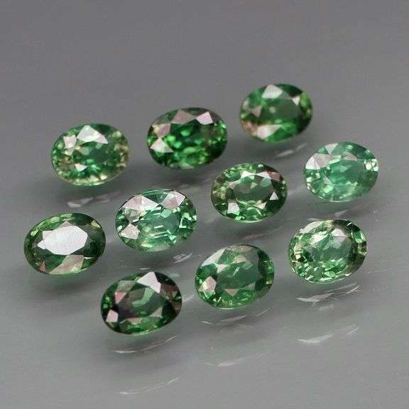 Heated only! 2.33ct blue green Sapphire set