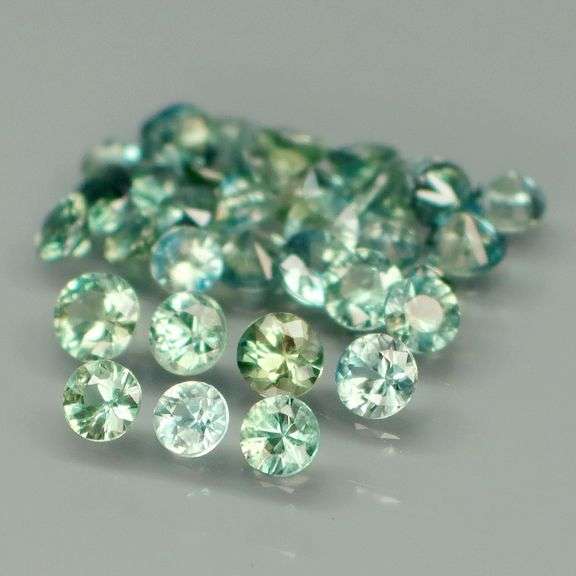 Exotic 4.01ct 35pc single vein bright blue green Sapphire set