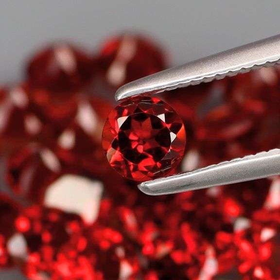 Outstanding 10.04ct diamond cut high fire Mozambique Garnet set