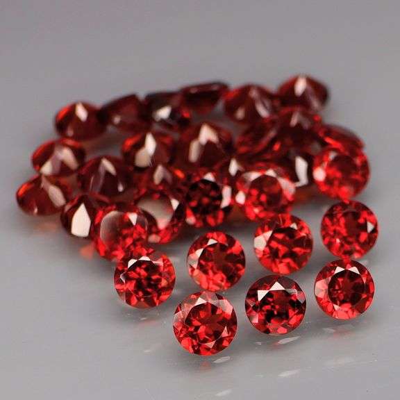 Outstanding 10.04ct diamond cut high fire Mozambique Garnet set
