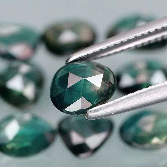 Awesome 4.60ct blue green rose cut Sapphire set!