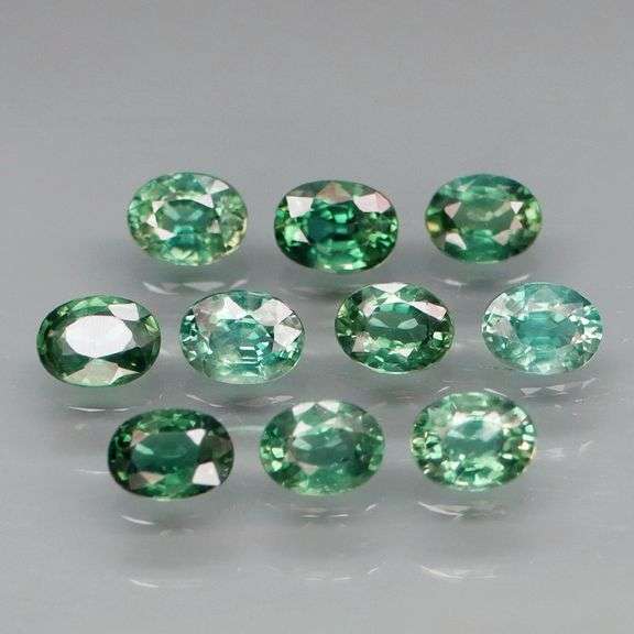 Heated only! 2.33ct blue green Sapphire set