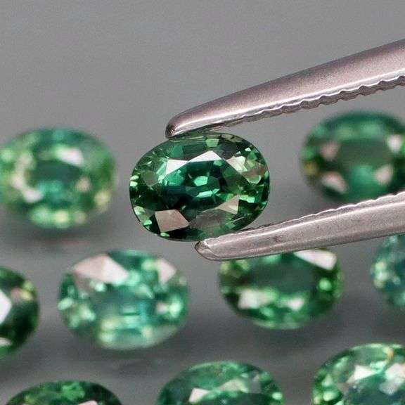 Heated only! 2.33ct blue green Sapphire set