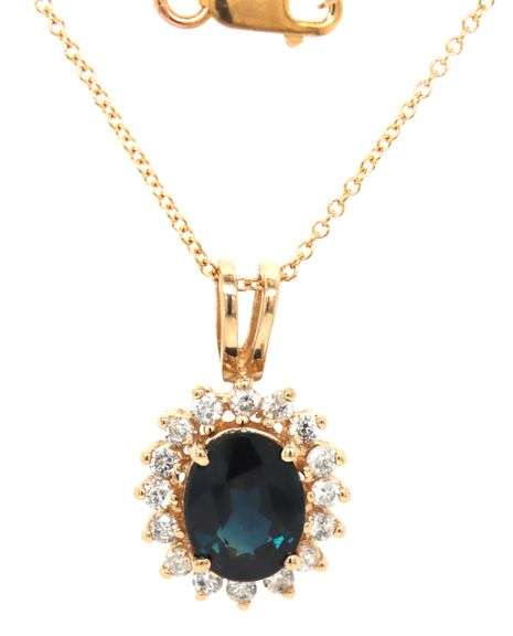 14kt Yellow gold oval blue sapphire and diamond halo pendant on chain