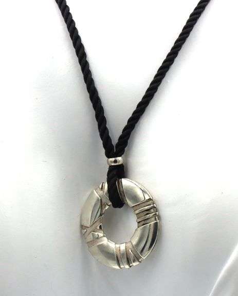 Tiffany & Co Atlas circle pendant on black cord necklace