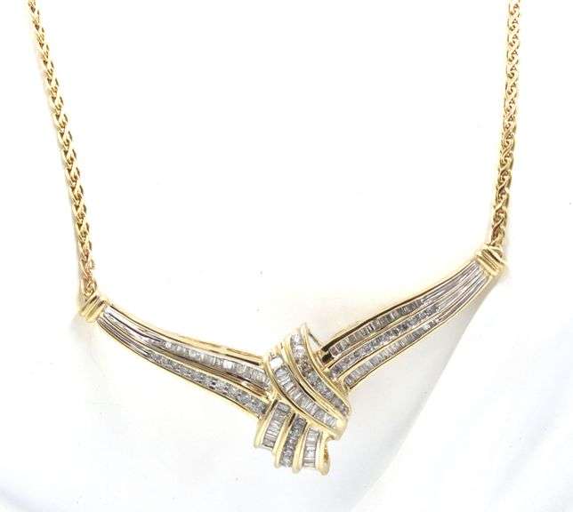 14kt Yellow gold baguette and round diamond V necklace