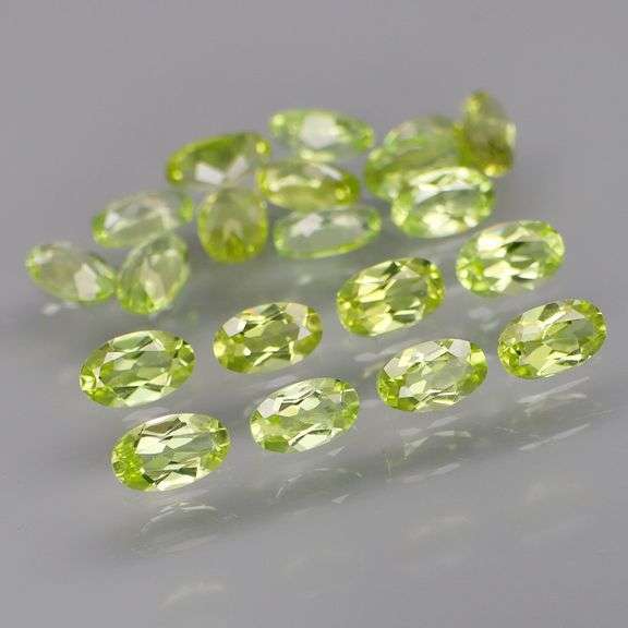 High grade 5.24ct untreated apple green Peridot set