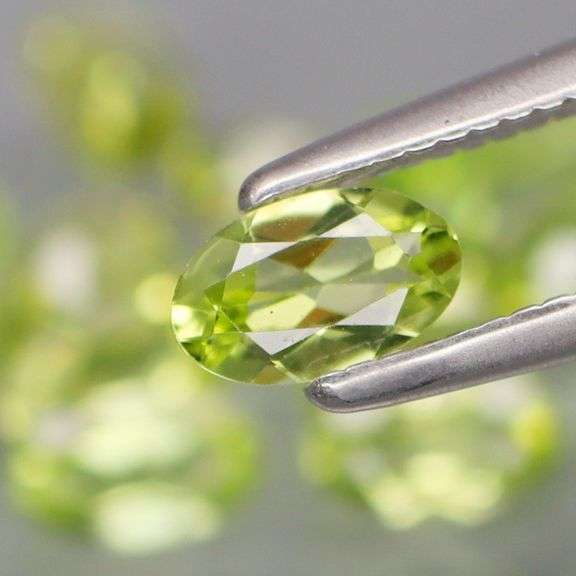 High grade 5.24ct untreated apple green Peridot set