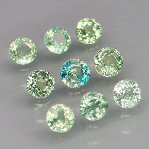 Exotic 2.70ct 9pc single vein blue green Sapphire set