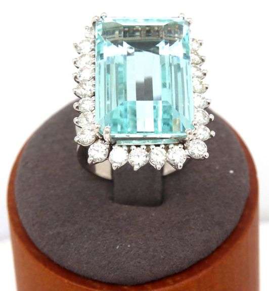 14kt White gold 22.93ct Emerald cut aquamarine and 1.75ctw diamond halo ring