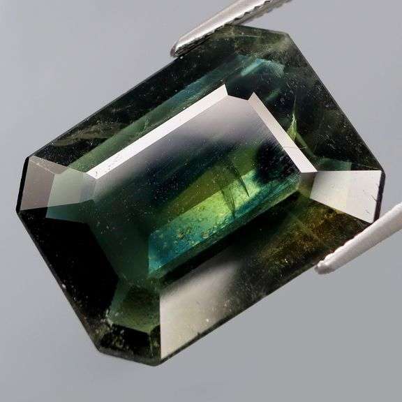 Massive! 13.02ct emerald cut Sapphire with swirling saturation!