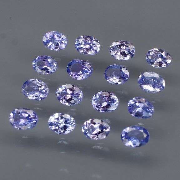 Heavy flashing 2.92ct oval cut Tanzanite set