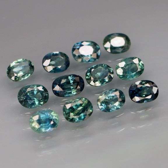 Heated only! 3.47ct bright blue green Sapphire set!