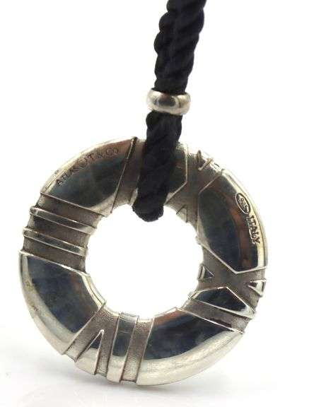 Tiffany & Co Atlas circle pendant on black cord necklace