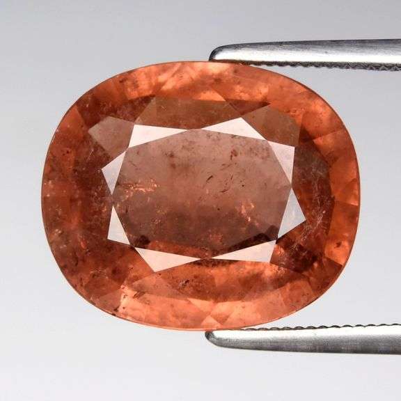 What the HECK??? It's a 5.77ct pinkish orange Tourmaline!
