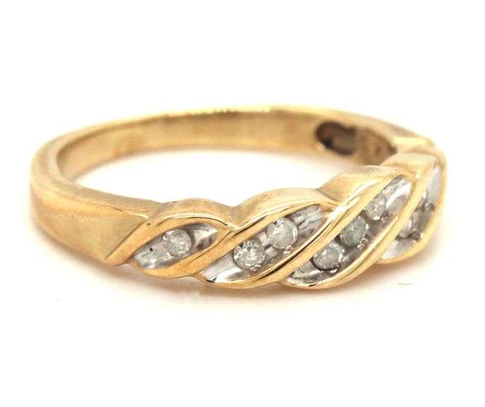 Sweet 10k yellow gold band with 9 small diamonds.