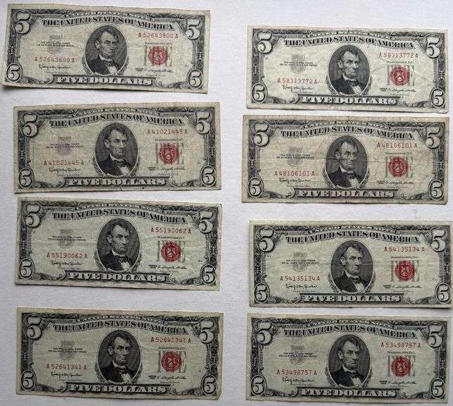 Eight $5 1963 Red Seal US Notes.