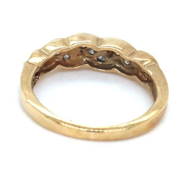 Sweet 10k yellow gold band with 9 small diamonds.