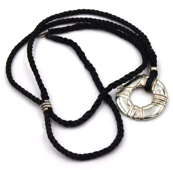 Tiffany & Co Atlas circle pendant on black cord necklace