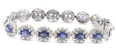 Enamoring Designer Oscar Friedman 9.76CTW Oval Faceted Tanzanite & Diamond Bracelet in 14K White Gol
