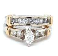 14kt White gold 0.70ctw marquise and round brilliant cut channel set diamond wedding set