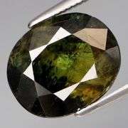 Huge 6.04ct deep swirling green high luster Sapphire!