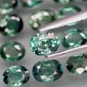 Heated only! 3.19ct blue green Sapphire set