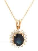 14kt Yellow gold oval blue sapphire and diamond halo pendant on chain