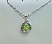 Beautiful sterling silver with center genuine natural dancing peridot with moissanite side stone pen