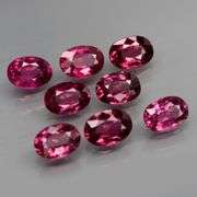 Rich 7.67ct oval cut violet pink Rodolite Garnet set
