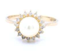 14kt Yellow gold 7mm pearl and diamond halo ring