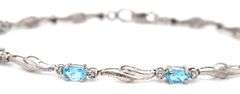 10kt White gold blue topaz and diamond with milgrain wave bracelet