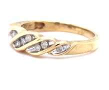 Sweet 10k yellow gold band with 9 small diamonds.
