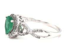 14kt White gold 0.65ct pear shaped emerald and 0.25ctw diamond infinity ring