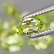 High grade 5.24ct untreated apple green Peridot set
