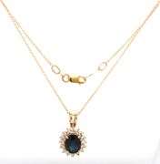 14kt Yellow gold oval blue sapphire and diamond halo pendant on chain