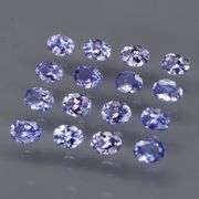 Heavy flashing 2.92ct oval cut Tanzanite set