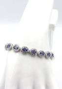 Enamoring Designer Oscar Friedman 9.76CTW Oval Faceted Tanzanite & Diamond Bracelet in 14K White Gol