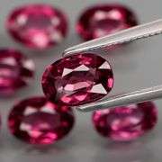 Rich 7.67ct oval cut violet pink Rodolite Garnet set