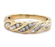 Sweet 10k yellow gold band with 9 small diamonds.