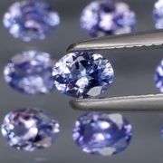 Heavy flashing 2.92ct oval cut Tanzanite set