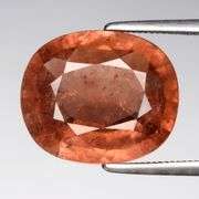What the HECK??? It's a 5.77ct pinkish orange Tourmaline!
