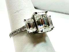 Sparkling 5.5 Ctw 3 Stone Emerald Cut Ice White Moissanite Ring