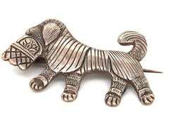 Vintage 925 sterling silver dog brooch carrying a basket