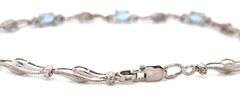 10kt White gold blue topaz and diamond with milgrain wave bracelet