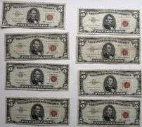 Eight $5 1963 Red Seal US Notes.